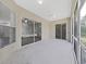 Spacious screened porch with ceiling fans and sliding glass doors at 3307 Kilmer Pl, Plant City, FL 33566