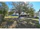 Large backyard with mature tree and home view at 3522 E 26Th Ave, Tampa, FL 33605