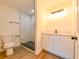 Contemporary bathroom with a walk-in shower, vanity, and modern fixtures at 3522 E 26Th Ave, Tampa, FL 33605