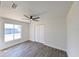 Spacious bedroom with double doors and ceiling fan at 3522 E 26Th Ave, Tampa, FL 33605