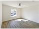 Well-lit bedroom with wood-look floors and a window at 3522 E 26Th Ave, Tampa, FL 33605