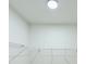White closet with wire shelving and hanging rods at 3522 E 26Th Ave, Tampa, FL 33605