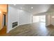 Spacious living room with fireplace and vinyl plank flooring at 3522 E 26Th Ave, Tampa, FL 33605