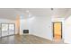 Open living room with a fireplace and access to a patio or backyard at 3522 E 26Th Ave, Tampa, FL 33605