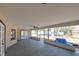Large screened porch with ceiling fan and concrete floor at 3522 E 26Th Ave, Tampa, FL 33605