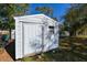 White metal storage shed in backyard at 3522 E 26Th Ave, Tampa, FL 33605