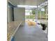 Backyard patio features a gravel pathway and landscaping at 3546 Cheswick Dr, Holiday, FL 34691