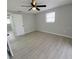 Spacious bedroom with tile floors and ceiling fan at 3546 Cheswick Dr, Holiday, FL 34691