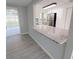 Granite breakfast bar overlooks the kitchen and dining area at 3546 Cheswick Dr, Holiday, FL 34691