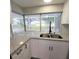 Kitchen with granite countertops and a view of the backyard at 3546 Cheswick Dr, Holiday, FL 34691