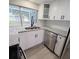 White shaker cabinets, granite counters, and stainless steel sink at 3546 Cheswick Dr, Holiday, FL 34691