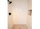 Clean shower with white tile and hexagon floor at 3546 Cheswick Dr, Holiday, FL 34691