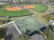 A high-angle view capturing tennis courts and baseball/softball fields within the community at 388 Countryside Key Blvd, Oldsmar, FL 34677