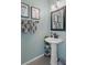 Modern bathroom with pedestal sink, and stylish decor at 388 Countryside Key Blvd, Oldsmar, FL 34677