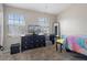 Bright bedroom with dresser, TV, and bed at 388 Countryside Key Blvd, Oldsmar, FL 34677