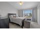 Bright bedroom with water view and plush bedding at 388 Countryside Key Blvd, Oldsmar, FL 34677