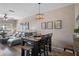 Dining area with a dark wood table and chairs, and a view to the living room at 388 Countryside Key Blvd, Oldsmar, FL 34677