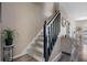Elegant staircase with dark wood railing and carpeted steps at 388 Countryside Key Blvd, Oldsmar, FL 34677