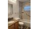 Bathroom with granite vanity and tub at 401 Dorchester Pl # 62, Sun City Center, FL 33573