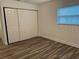 Bedroom closet with shelves and hanging rod at 401 Dorchester Pl # 62, Sun City Center, FL 33573