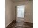 Walk-in closet with built-in shelving and hanging rods at 401 Dorchester Pl # 62, Sun City Center, FL 33573