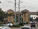 Community entrance with traffic and landscaping at 401 Dorchester Pl # 62, Sun City Center, FL 33573