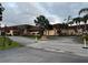 Building exterior with landscaping and driveway at 401 Dorchester Pl # 62, Sun City Center, FL 33573