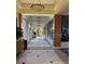 Building hallway with tiled floor and a wooden cabinet at 401 Dorchester Pl # 62, Sun City Center, FL 33573
