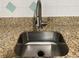 Stainless steel kitchen sink with modern faucet at 401 Dorchester Pl # 62, Sun City Center, FL 33573