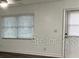 Living room with window and door access at 401 Dorchester Pl # 62, Sun City Center, FL 33573
