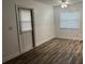 Living room with wood-look flooring and sliding glass door at 401 Dorchester Pl # 62, Sun City Center, FL 33573
