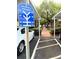 Covered carport parking with walkway access at 401 Dorchester Pl # 62, Sun City Center, FL 33573