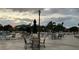 Community pool area with lounge chairs and tables at 401 Dorchester Pl # 62, Sun City Center, FL 33573