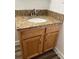 Granite countertop bathroom vanity with wood cabinets at 401 Dorchester Pl # 62, Sun City Center, FL 33573