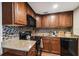 Modern kitchen with granite counters and dark wood cabinets at 4015 Bayshore Blvd # 9D, Tampa, FL 33611