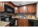 Modern kitchen with granite counters and dark wood cabinets at 4015 Bayshore Blvd # 9D, Tampa, FL 33611