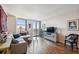 Spacious living room featuring hardwood floors and a comfortable L-shaped sofa at 4015 Bayshore Blvd # 9D, Tampa, FL 33611