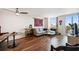 Bright living room with wood floors, L-shaped sofa, and access to a balcony at 4015 Bayshore Blvd # 9D, Tampa, FL 33611
