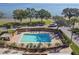 Community pool with brick border and ample seating at 4015 Bayshore Blvd # 9D, Tampa, FL 33611