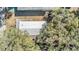Aerial view of a single story home surrounded by trees at 4711 Olive Dr, Zephyrhills, FL 33542