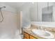 Clean bathroom, granite countertop, and a shower/tub combo at 4711 Olive Dr, Zephyrhills, FL 33542