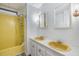 Bathroom with yellow bathtub and double vanity at 4711 Olive Dr, Zephyrhills, FL 33542