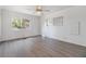 Spacious bedroom with laminate flooring and a ceiling fan at 4711 Olive Dr, Zephyrhills, FL 33542