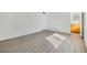 Bright bedroom with laminate flooring and access to bathroom at 4711 Olive Dr, Zephyrhills, FL 33542