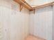 Large closet with wood paneling and shelving at 4711 Olive Dr, Zephyrhills, FL 33542