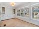 Bright dining area with built-in cabinets and wood flooring at 4711 Olive Dr, Zephyrhills, FL 33542