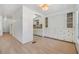 Living room with wood flooring and access to other rooms at 4711 Olive Dr, Zephyrhills, FL 33542