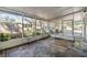 Screened porch with tiled floor and access to backyard at 4711 Olive Dr, Zephyrhills, FL 33542