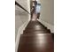 Elegant wooden staircase leading to the upper level at 4754 Pond Ridge Dr, Riverview, FL 33578