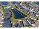 Aerial view of community with lake, pool, and homes at 5658 Del Coronado Dr, Apollo Beach, FL 33572